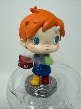 Orange-Haired Kids Vinyl Figure with Blue Outfit and Multicolor Boots